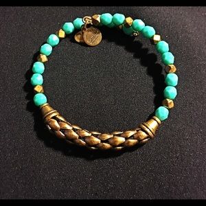 Turquoise colored and brass beaded spiral bracelet